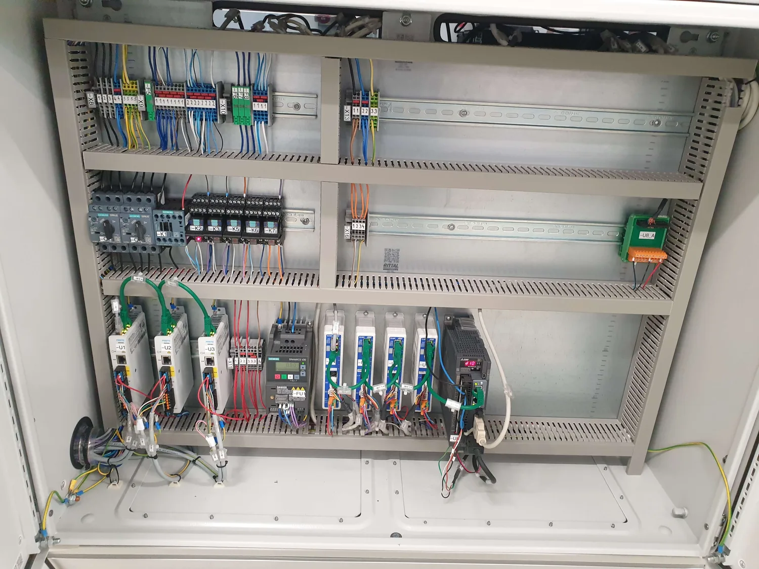 Festo drives and a Siemens Sinamics V20 frequency inverter in the control cabinet