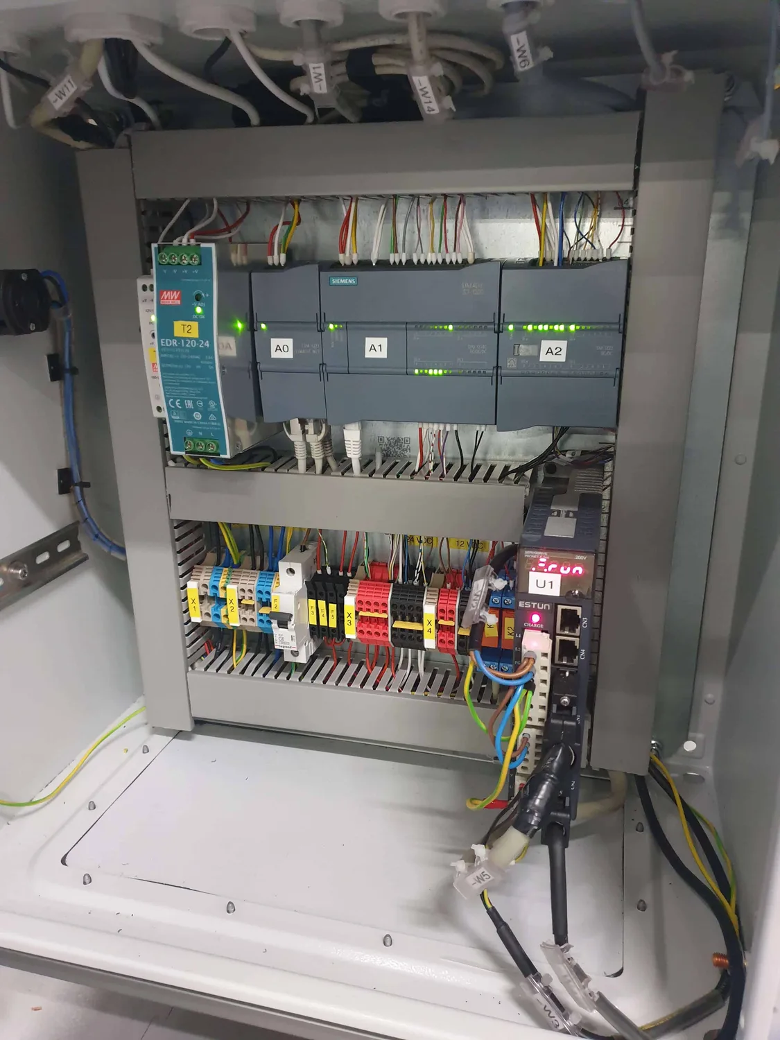 Siemens SIMATIC S7-1200 PLC and Estun servo drive in the control cabinet of the KRIVULJA machine