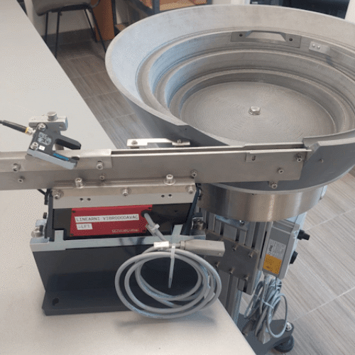 Bowl and linear feeder for metal parts.