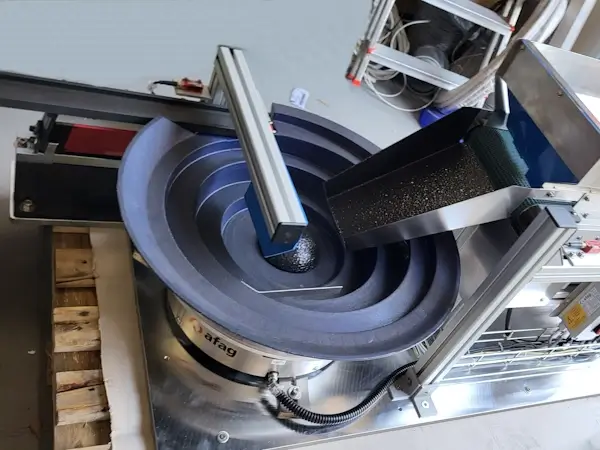ENSO Vibrofeeder System for Strojotehnika (Zagreb): Circular and linear vibratory feeder with AFAG drive for supplying metal rings